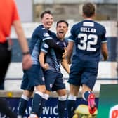 Lewis Vaughan, centre, celebrates scoring his second goal against Dunfermline.
