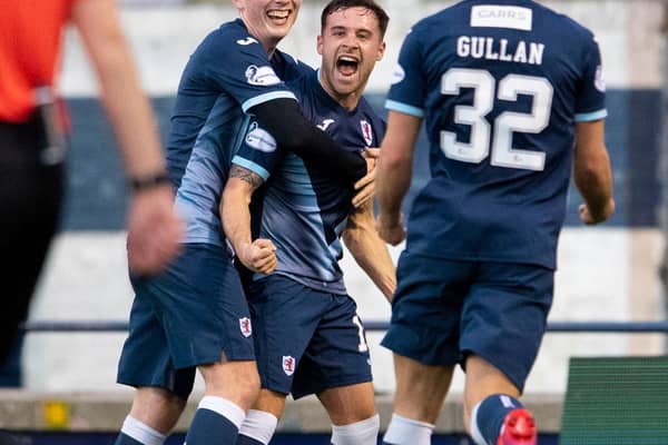 Lewis Vaughan, centre, celebrates scoring his second goal against Dunfermline.