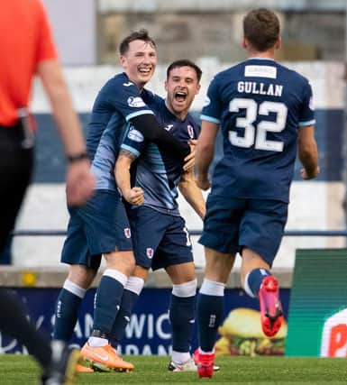 Lewis Vaughan, centre, celebrates scoring his second goal against Dunfermline.