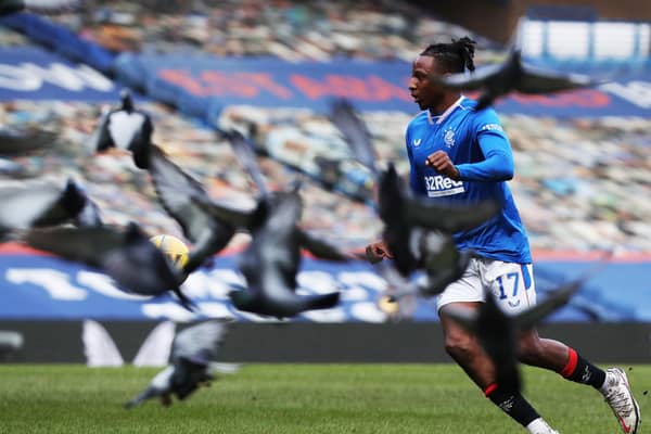 Joe Aribo of Rangers controls the ball as  flock of Pigeons fly past during the Ladbrokes Scottish Premier League match between Rangers and Dundee United at Ibrox Stadium on February 21, 2021 in Glasgow, Scotland.  (Photo by Ian MacNicol/Getty Images)