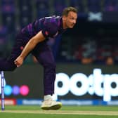 Josh Davey of Scotland in bowling action.