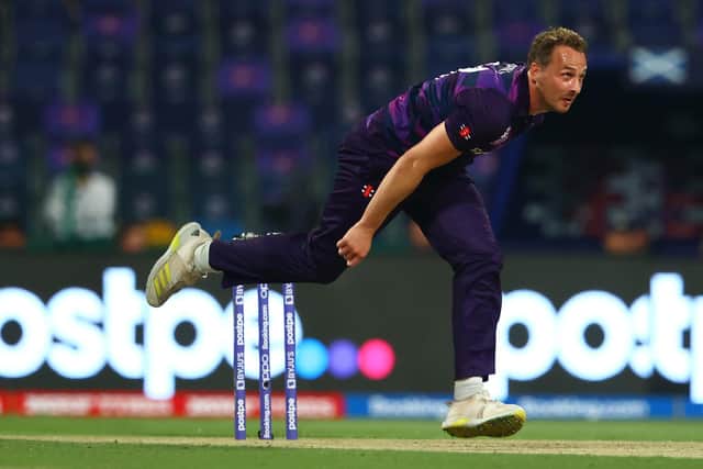 Josh Davey of Scotland in bowling action.