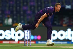 Josh Davey of Scotland in bowling action.