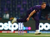 Josh Davey of Scotland in bowling action.