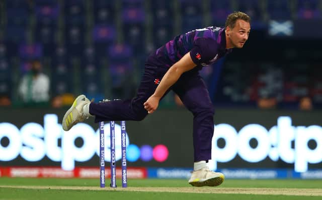 Josh Davey of Scotland in bowling action.