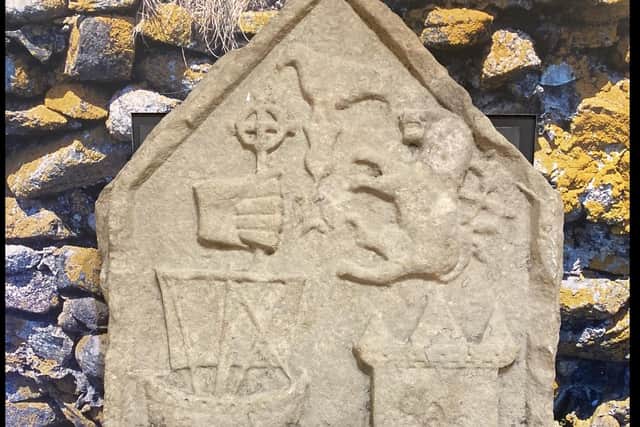 The 16th Century gravestone of John of Moidart, chief of Clanranald, was stolen from South Uist - and found in a flat in Euston five years later. PIC: Contributed.