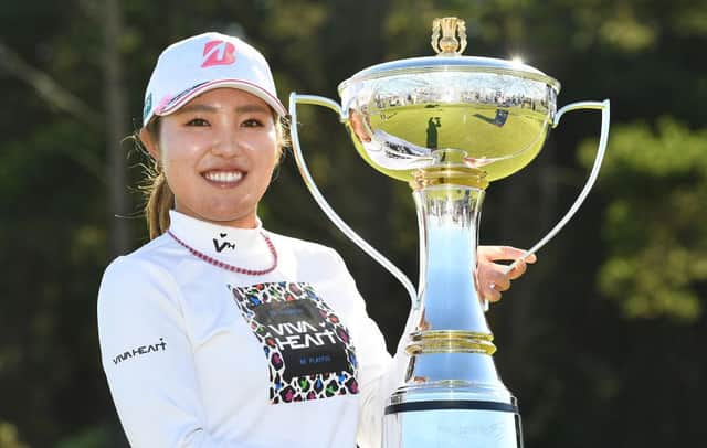Ayaka Furue poses with the trophy after winning the 2022 Trust Golf Women's Scottish Open at Dundonald Links, where the event will be held once again in 2023. Mark Runnacles/Getty Images.