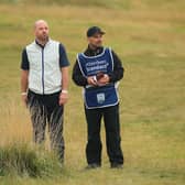 Craig Lee and caddie Gavin Tullis talk tactics on the 10th hole during the first round of the Aberdeen Standard Investments Scottish Open at The Renaissance Club. Picture: Andrew Redington/Getty Images