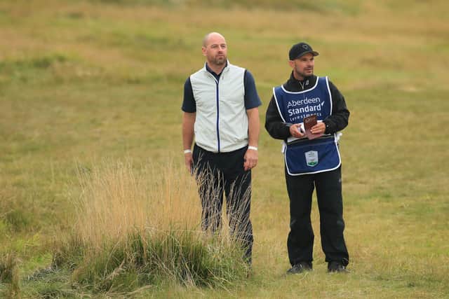 Craig Lee and caddie Gavin Tullis talk tactics on the 10th hole during the first round of the Aberdeen Standard Investments Scottish Open at The Renaissance Club. Picture: Andrew Redington/Getty Images