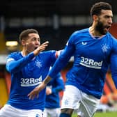 Rangers Connor Goldson celebrates with fellow defender James Tavernier.