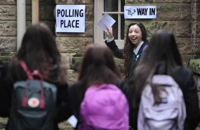 A group of 16-year-old voters make their way to a polling place to vote in the 2014 referendum. Picture: Neil Hanna