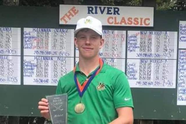Midland College player Gregor Graham shows off the trophy after his win in the Bosque River Classic in Waco, Texas.