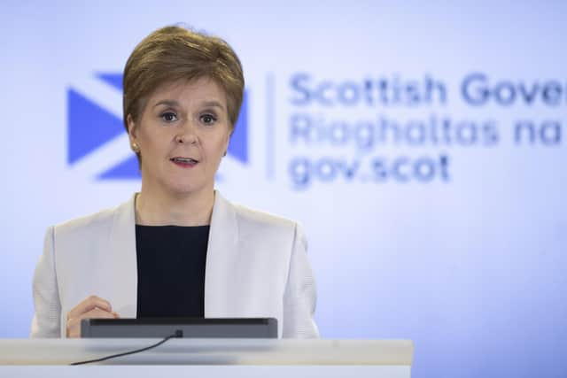 Nicola Sturgeon at the podium in 2020 for a Covid briefing (Picture: Jane Barlow/WPA Pool/Getty Images)