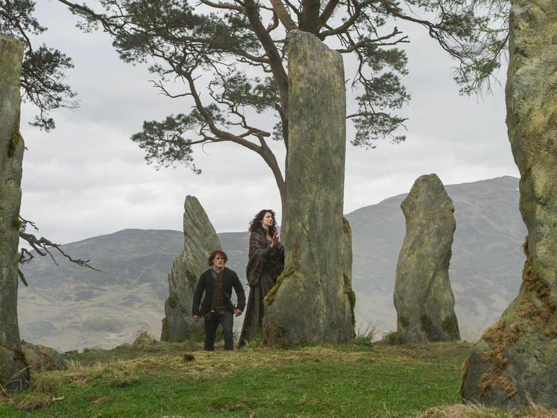 This ancient stone circle is the location where Claire time travels from 1945 to 1743. It is inspired by real locations in Scotland like the Clava Cairns in Inverness but it is not actually real. To pronounce the name of this site try to say “craik-na-doon”.