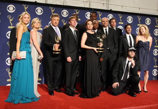 Tina Fey and fellow 30 Rock cast members with their Emmy for Outstanding Comedy Series in 2009. Picture: Jason Merritt/Getty Images.