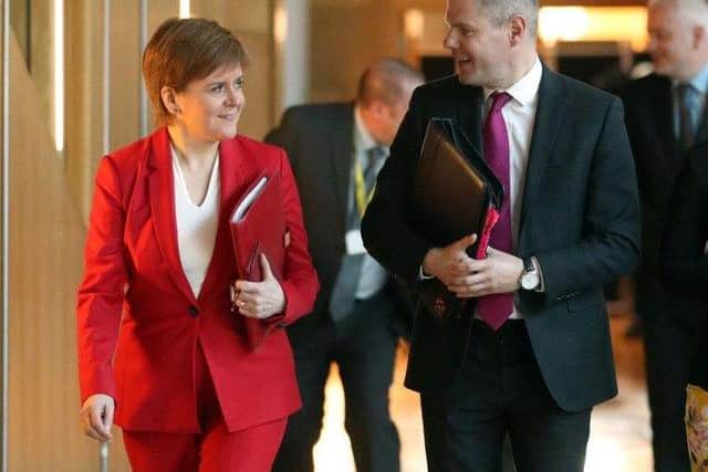 First Minister Nicola Sturgeon and former finance secretary Derek Mackay. Picture: PA Wire