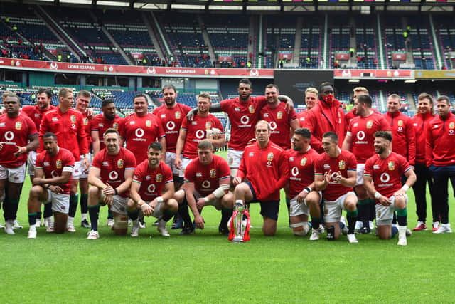 The Lions, with injured captain Alun Wyn Jones, pose with the 1888 Cup after the win over Japan.