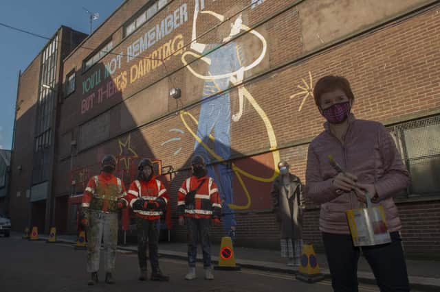 First Minister Nicola Sturgeon was at the Barrowlands in Glasgow to see the Shuggie Bain Mural painted by Artists Erin Bradley-Scott, Chelsea Frew and Kat Louden from the Cobalt Collective.