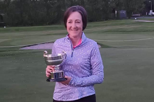 Stirling's Alison Davidson shows off the trophy after landing a tenth triumph in the Stirling & Clackmannan Ladies ' Championship at Bathgate.