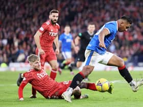 Rangers striker Alfredo Morelos tries to get the better of Aberdeen defender Hayden Coulson.