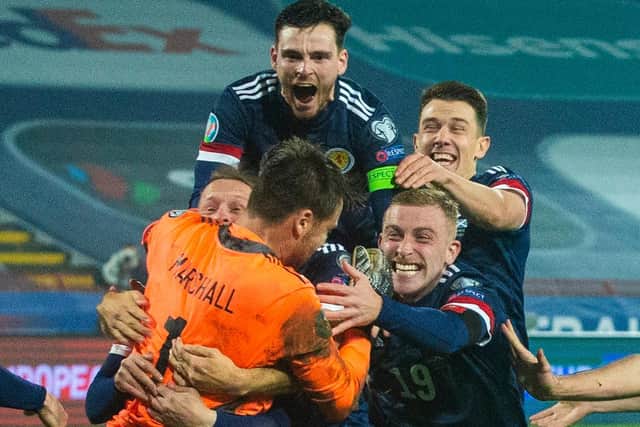 Andy Roberston celebrates with his Scotland team-mates after David Marshall penalty save in the Nations League final against Serbia allowed the country to make a "giant leap" of sealing a place at this summers Euros to make a major finals for the first time since 1998. (Photo by Nikola Krstic / SNS Group)