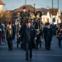 Members of the public pay their respects as the horse drawn hearse carrying the coffin of Sir David Amess, arrives at his constituency office at Iveagh Hall, in Leigh-on-Sea, following his funeral service. Picture: Aaron Chown/PA Wire