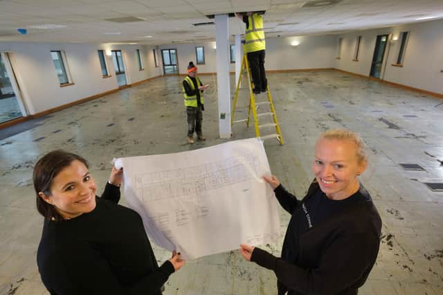 Laura Proudfoot and Marcella Macdonald checking out the plans for the new academy.
