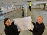 Laura Proudfoot and Marcella Macdonald checking out the plans for the new academy.