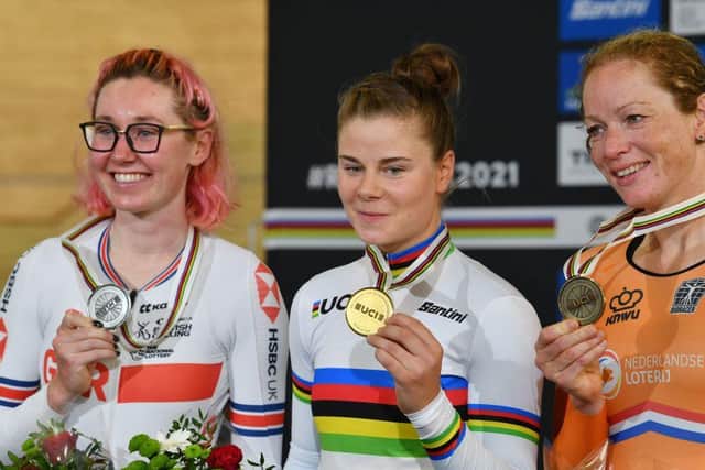 Gold medallist Belgium's Lotte Kopecky (C) celebrates on podium with silver medallist Great Britain's Katie Archibald (L) and bronze medallist Netherlands' Kirsten Wild after the Women's Points race. (Photo by DENIS CHARLET/AFP via Getty Images)