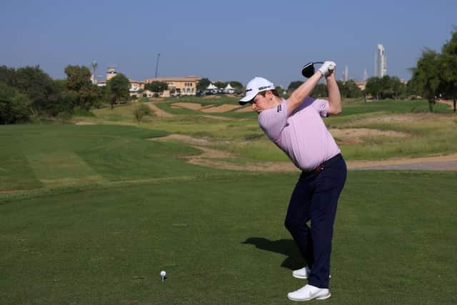 Bob Macintyre hits his drive at the 18th on the Fire Course at Jumeirah Golf Estates. Picture: Andrew Redington/Getty Images.