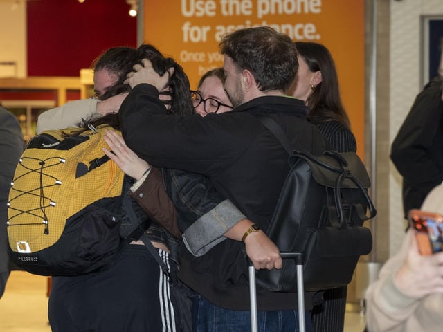 Reunited: Passengers arrive home on Emirates flight