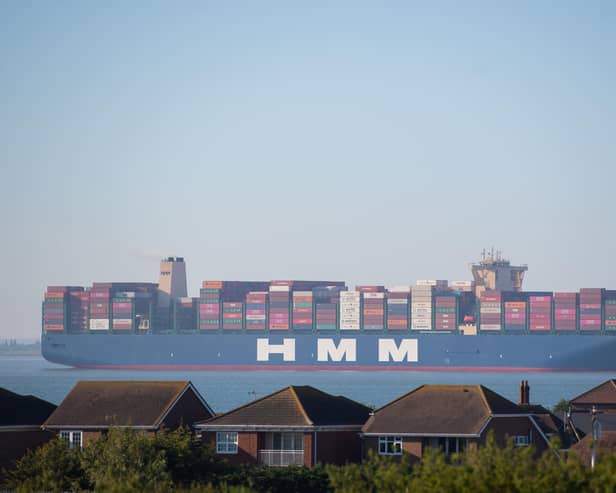 HMM Algeciras, the world's largest container ship, passes Canvey Island in Essex as it arrives in the UK for the first time.