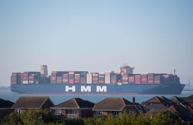 HMM Algeciras, the world's largest container ship, passes Canvey Island in Essex as it arrives in the UK for the first time.