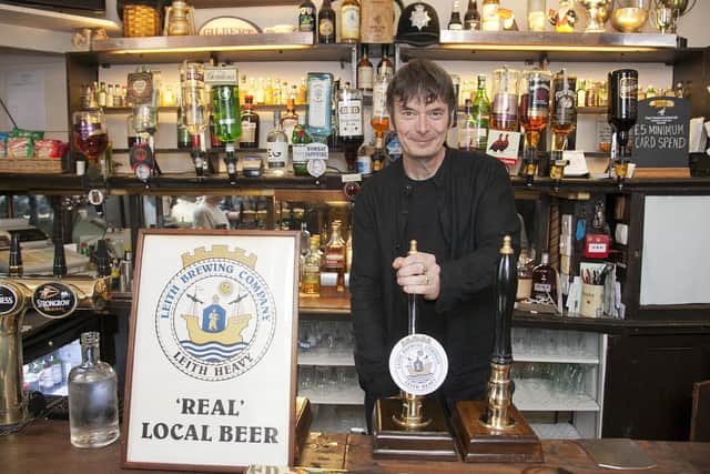 Ian Rankin pulling the first pint of Leith heavy at the Oxford bar
