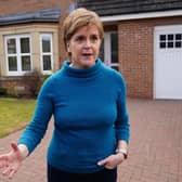 Nicola Sturgeon speaks to the media outside her home in Uddingston