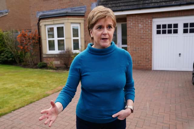 Nicola Sturgeon speaks to the media outside her home in Uddingston