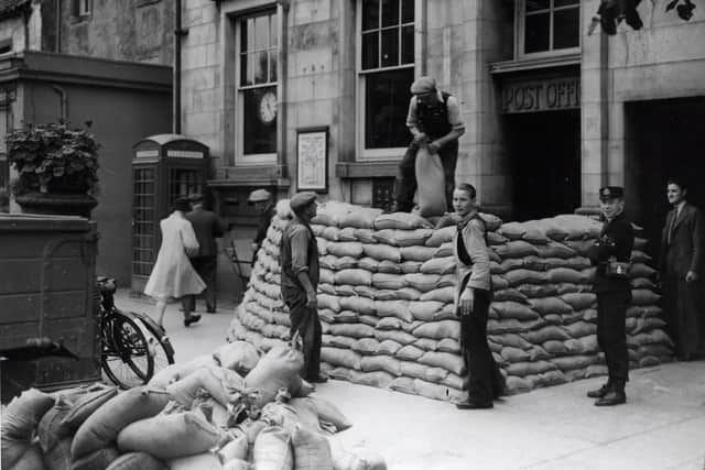 Soldiers from the 1st Parachute Brigade building defences outside the Post Office in South Street, St Andrews