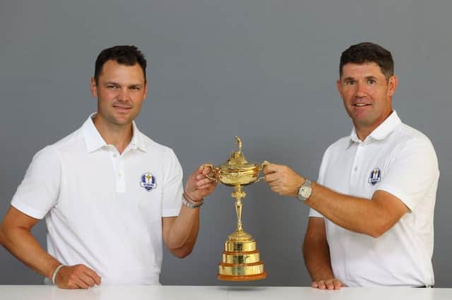 Martin Kaymer and Padraig Harrington pose with the Ryder Cup prior to the BMW International Open at Golfclub Munchen Eichenried in Munich. Picture: Andrew Redington/Getty Images.