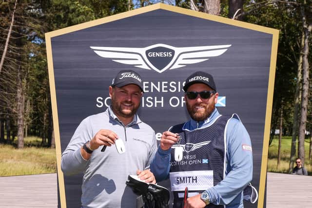 Jordan Smith and caddie Sam Matton after being presented with kys for their new Genesis cars after Smith's hole-in-one at the 17th at The Renaissance Club in the secon round of the Genesis Scottish Opn. Picture: Luke Walker/Getty Images.