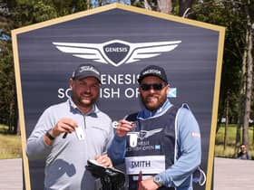 Jordan Smith and caddie Sam Matton after being presented with kys for their new Genesis cars after Smith's hole-in-one at the 17th at The Renaissance Club in the secon round of the Genesis Scottish Opn. Picture: Luke Walker/Getty Images.