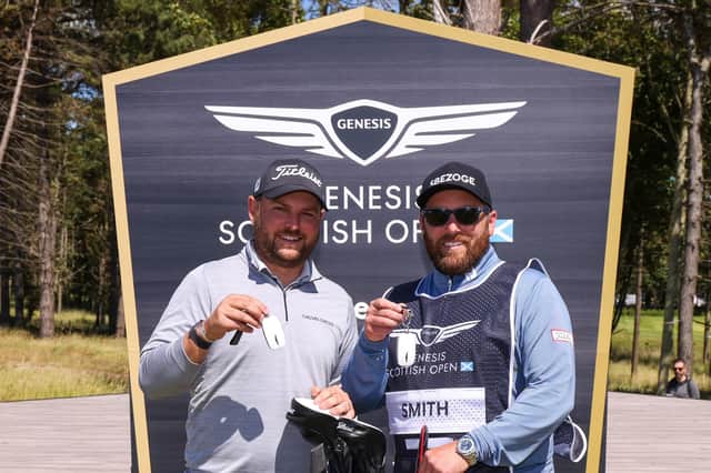 Jordan Smith and caddie Sam Matton after being presented with kys for their new Genesis cars after Smith's hole-in-one at the 17th at The Renaissance Club in the secon round of the Genesis Scottish Opn. Picture: Luke Walker/Getty Images.