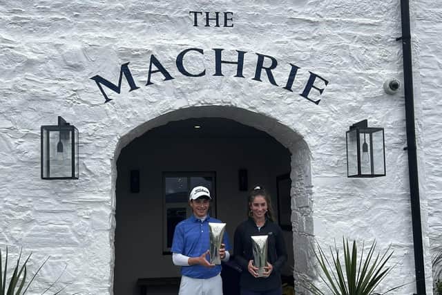 Sam Mukherjee and Summer Elliot show off their respective trophies at The Machrie.