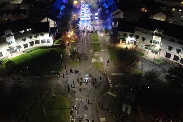 Police Scotland officers standing in a line in the Niddrie area of Edinburgh where around 100 young people clashed with riot police, with fireworks being thrown directly at officers. Photo: Handout/PA Wire