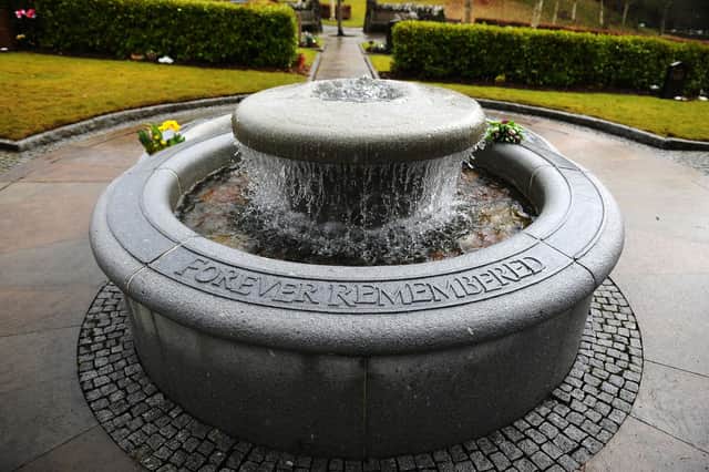 The Dunblane Cemetery memorial garden features a fountain and a commemorative plaque, where the names of the victims are listed in the order they were read out by the police officer that night. Photo: Michael Gillen.