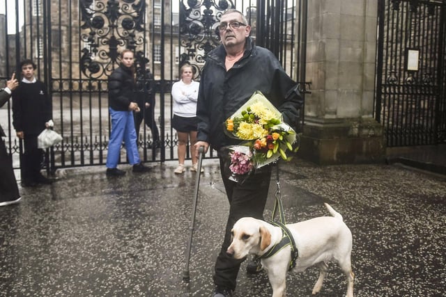 A man walking his dog made a detour to pay his respects to the long-reigning monarch.