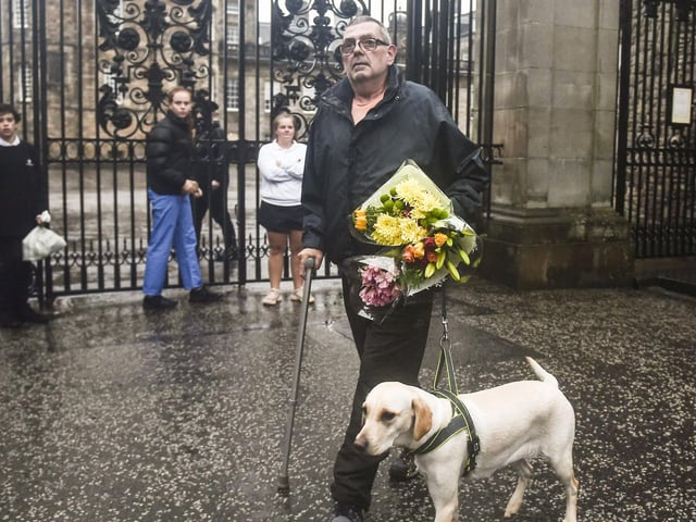 A man walking his dog made a detour to pay his respects to the long-reigning monarch.