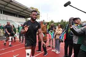 South Africa captain Siya Kolisi greets fans during a South Africa training session.