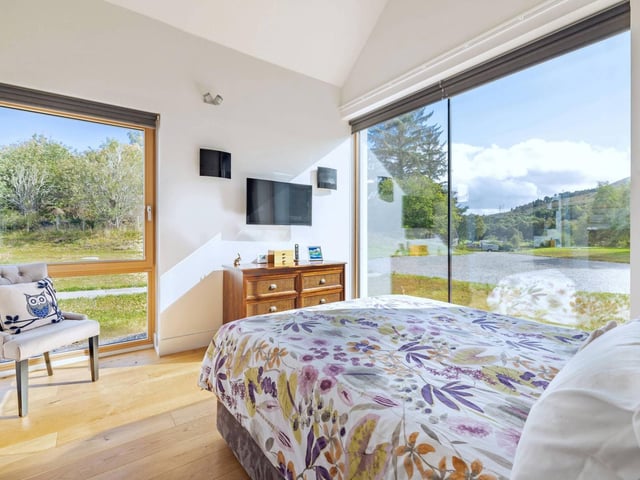 Interior: The three-bedroom home features a contemporary open-plan kitchen and dining room, plus lounge with stove. A cinema upstairs provides a great space for entertaining.