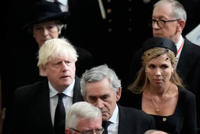 Former British Prime Minister Boris Johnson, centre left, as his wife Carrie, centre right, walk with other British prime ministers David Cameron, Theresa May and Gordon Brown as they leave Westminster Abbey in London. Picture: Frank Augstein/POOL/AFP via Getty Images