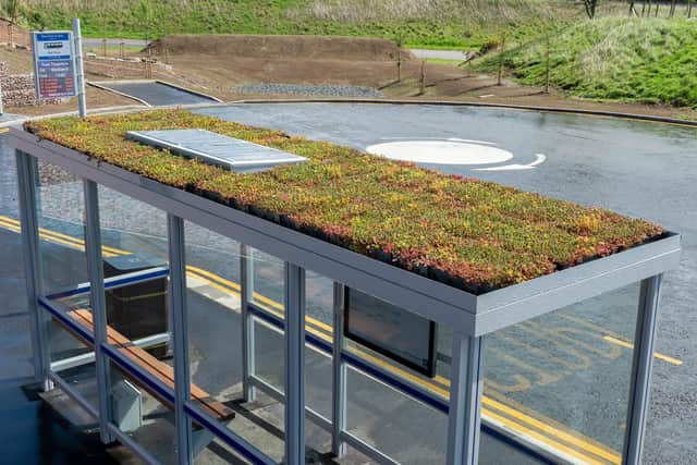 The new low-profile enclosed bus shelters feature sedum vegetation roofing and solar-powered LED lighting.